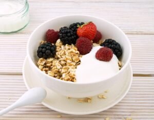 Warm Oat in a bowl with berries.