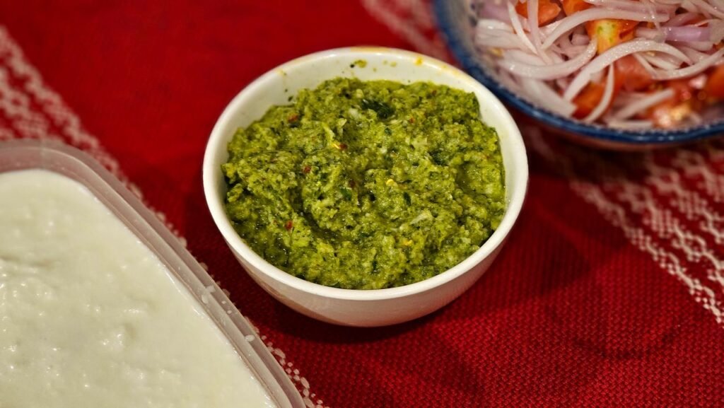 Close-up of green sauce and dip in one.