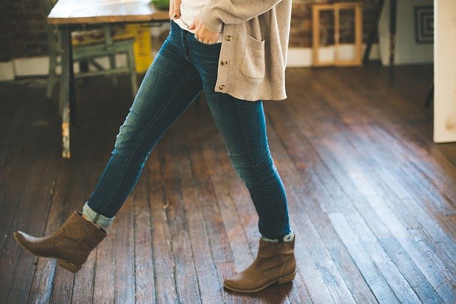 A lady walking indoor wearing jeans, every step adds on.