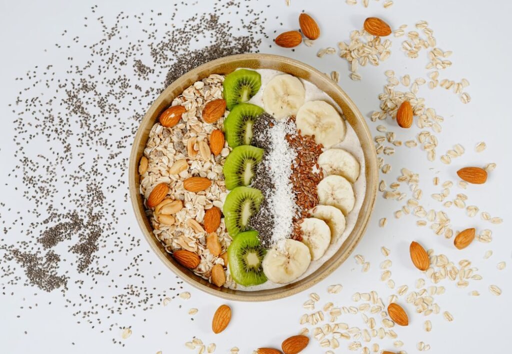 Oat with yogurt, banana and other fruits - almonds.